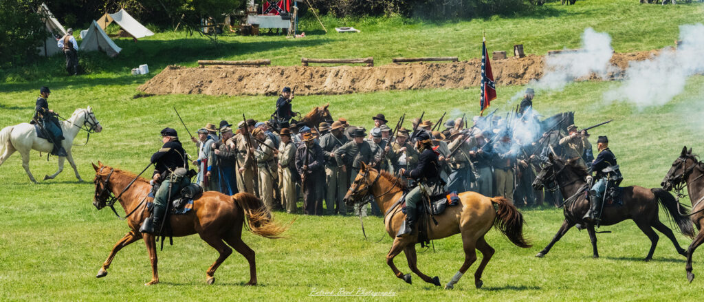 Union cavalry soldiers charging into battle, aggressively attacking Confederate positions. Mounted on powerful horses, they are dressed in blue uniforms, wielding sabers and pistols, exuding energy and determination as they advance towards the enemy lines, showcasing the intensity of Civil War combat.